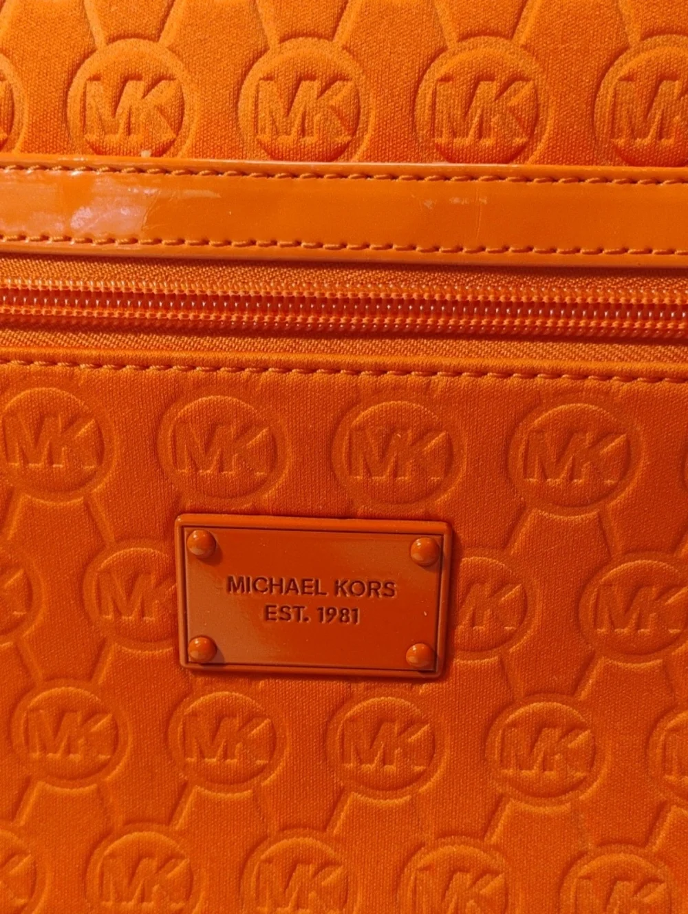Michael Kors Neoprene Tangerine Mono Embossed Swing Crossbody bag